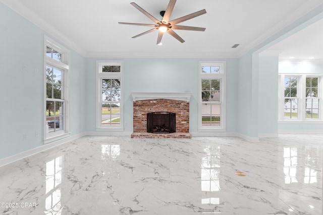 unfurnished living room with a fireplace, ceiling fan, and crown molding