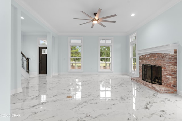 unfurnished living room featuring a fireplace, ornamental molding, and ceiling fan