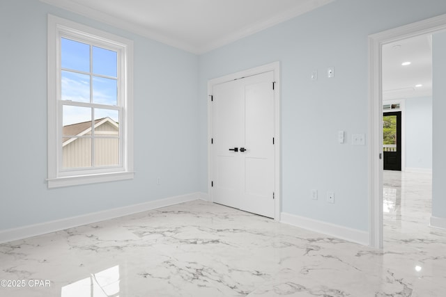 unfurnished room featuring ornamental molding