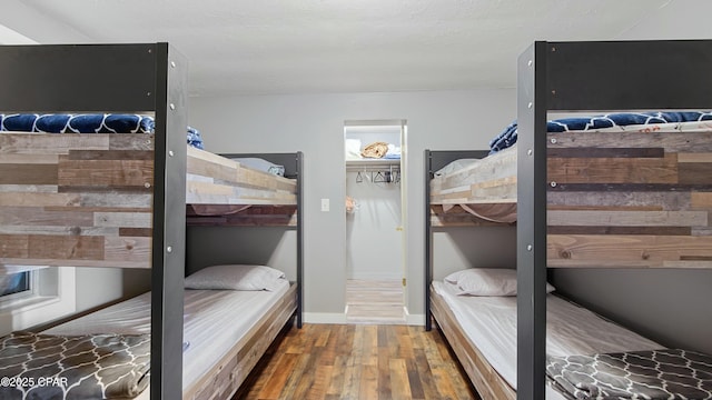 bedroom with wood-type flooring