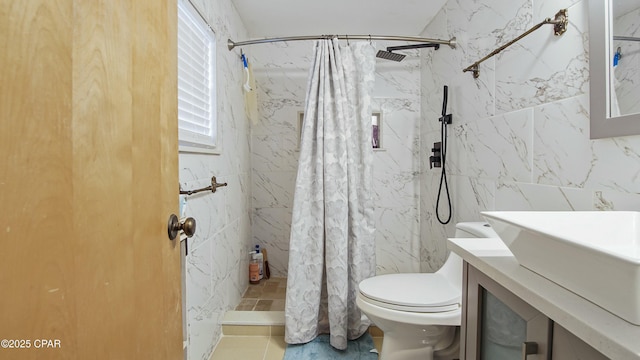 bathroom with toilet, vanity, and a shower with shower curtain