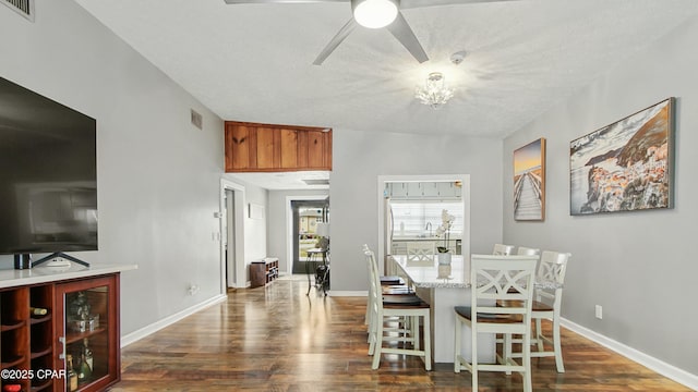 dining room with dark hardwood / wood-style floors