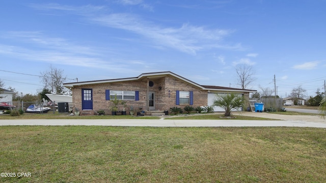 view of front of property with a front lawn and central air condition unit