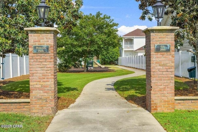 view of community featuring a yard and a playground