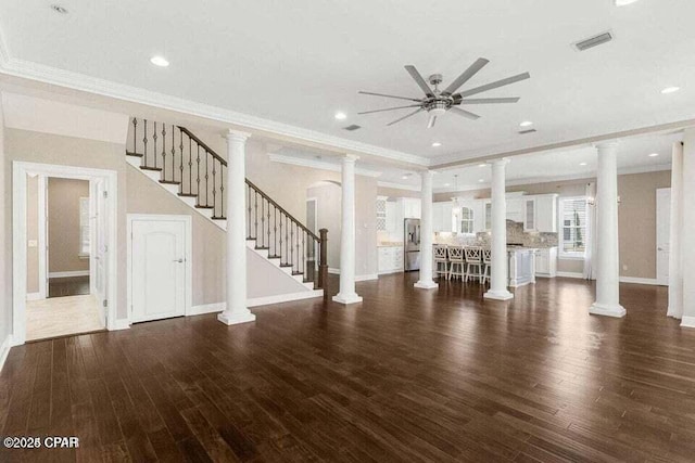 unfurnished living room featuring ceiling fan, crown molding, and dark hardwood / wood-style floors