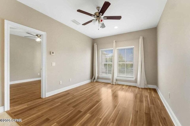 empty room with hardwood / wood-style floors