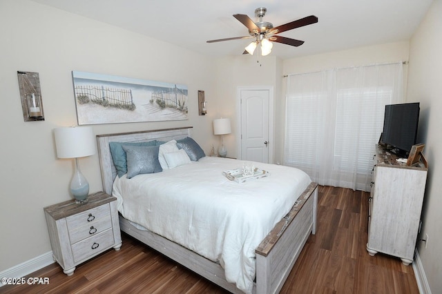 bedroom featuring ceiling fan and dark hardwood / wood-style floors