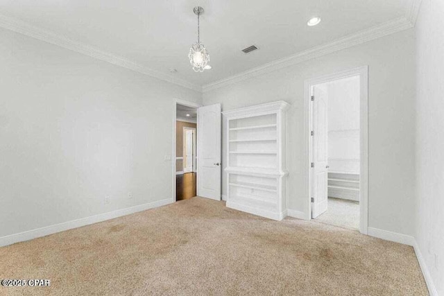 unfurnished bedroom featuring crown molding and light colored carpet