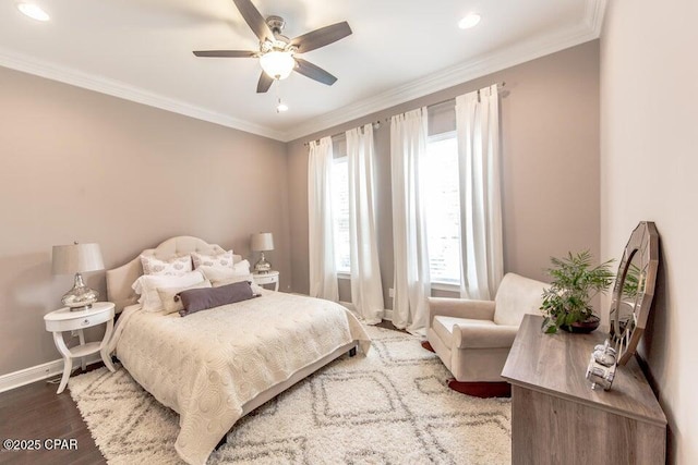 bedroom featuring ceiling fan, ornamental molding, and wood-type flooring