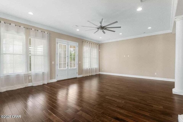 unfurnished room with ceiling fan, dark wood-type flooring, ornamental molding, and decorative columns