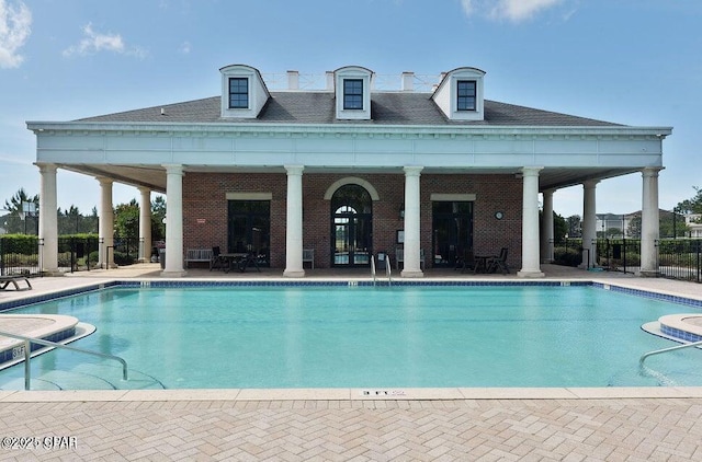 view of swimming pool with a patio