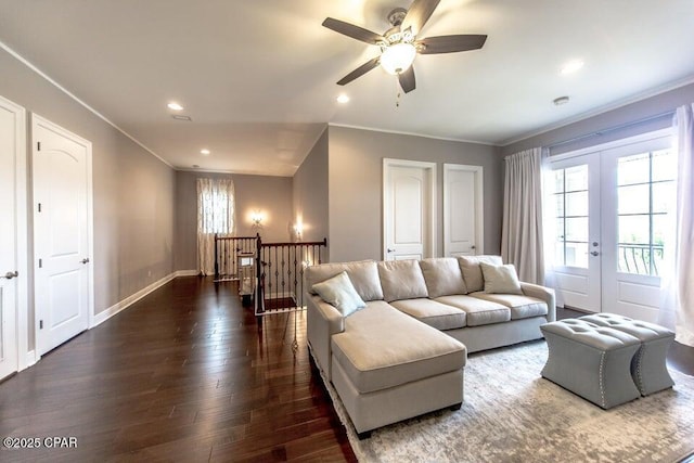 living room with dark wood-type flooring, french doors, ceiling fan, and crown molding