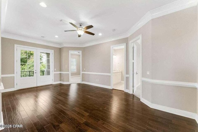 spare room featuring french doors, ceiling fan, ornamental molding, and dark wood-type flooring