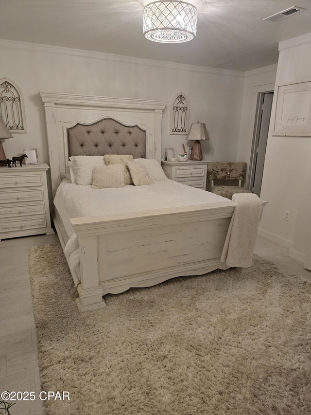 bedroom featuring crown molding