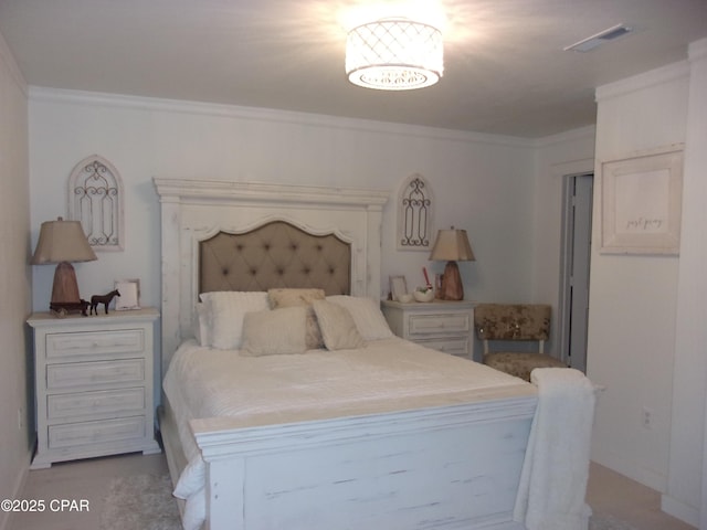 bedroom with crown molding and light carpet