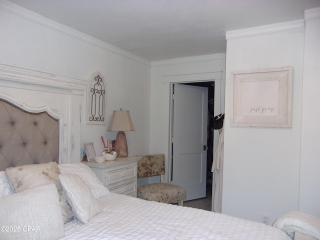 bedroom featuring crown molding