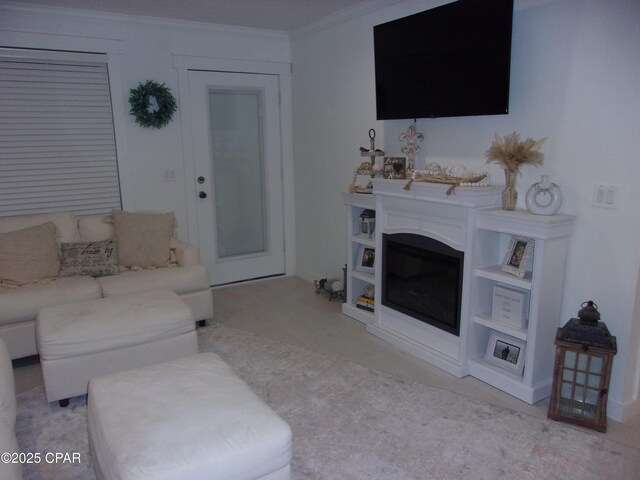 living room with ornamental molding and light carpet