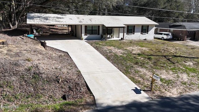 single story home with a carport and a porch