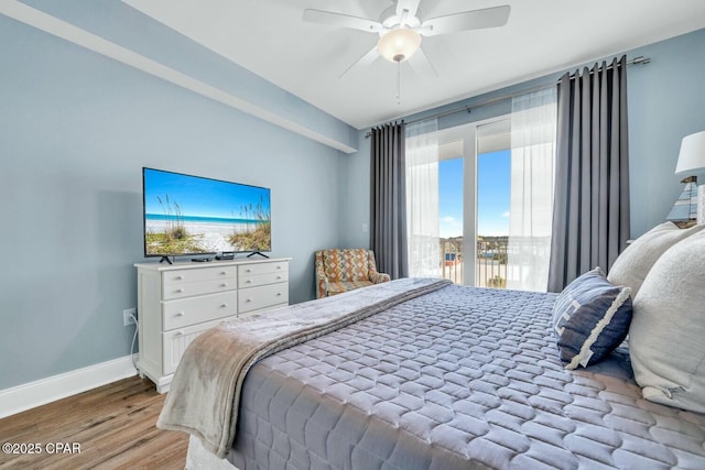 bedroom featuring ceiling fan, light hardwood / wood-style floors, and access to outside