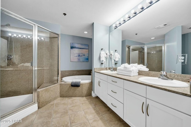 bathroom featuring separate shower and tub, tile patterned floors, and vanity