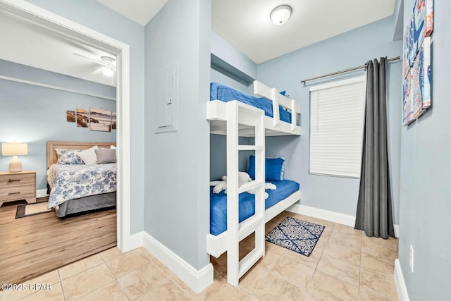 tiled bedroom with electric panel