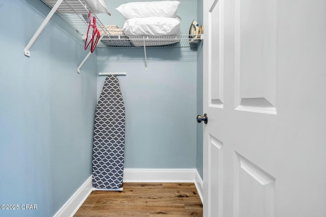 walk in closet featuring hardwood / wood-style flooring