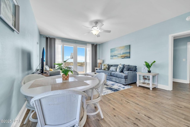 dining area featuring ceiling fan and hardwood / wood-style floors