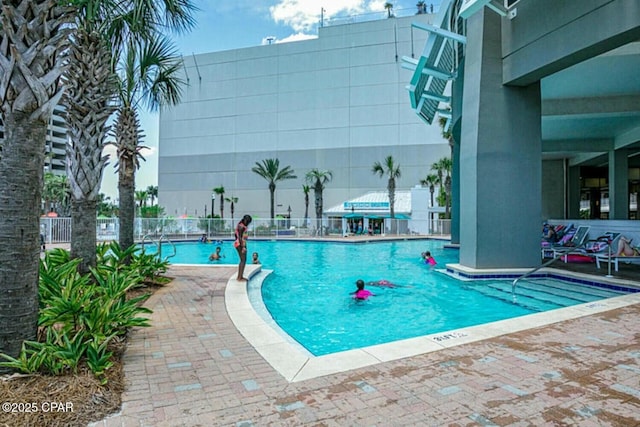 view of swimming pool featuring a patio area