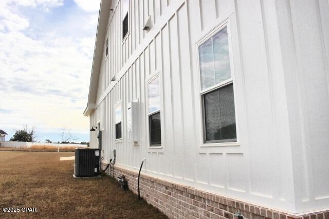 view of side of home featuring central air condition unit