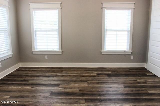 empty room featuring dark wood-type flooring