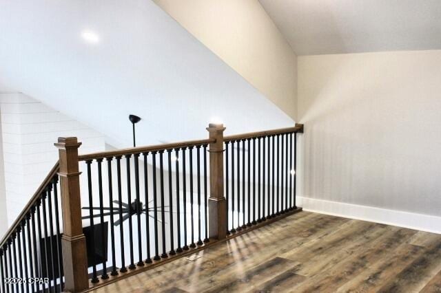 stairway featuring hardwood / wood-style floors