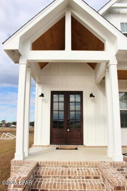 doorway to property featuring french doors