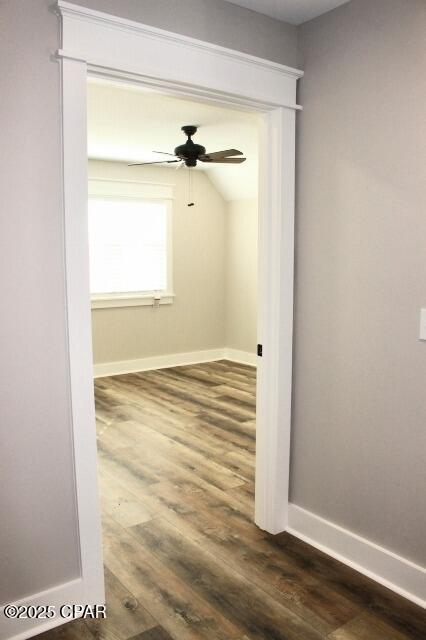 empty room featuring ceiling fan and dark hardwood / wood-style floors