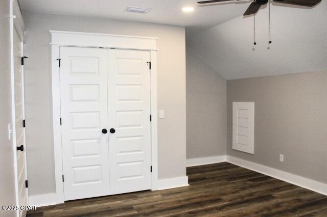 bonus room featuring dark wood-type flooring and ceiling fan