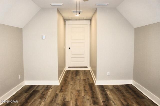 bonus room featuring lofted ceiling and dark wood-type flooring