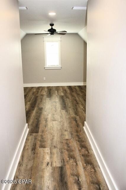 bonus room featuring dark hardwood / wood-style flooring, ceiling fan, and vaulted ceiling