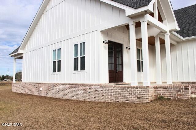 view of side of property with a yard