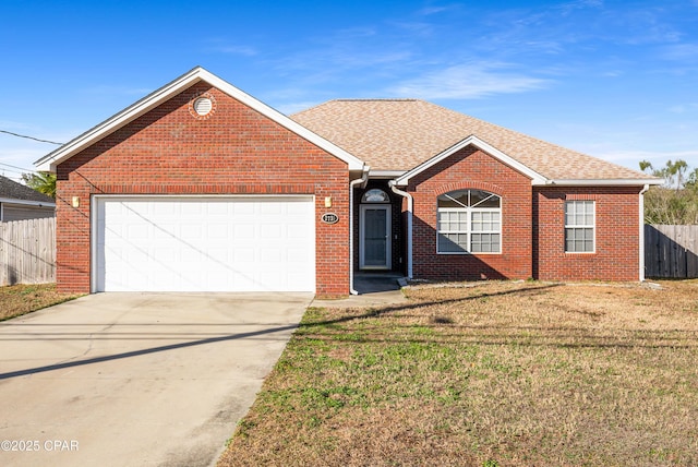 ranch-style home with concrete driveway, roof with shingles, an attached garage, fence, and a front yard