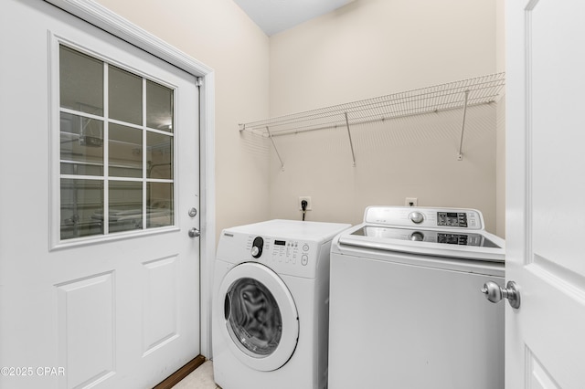 laundry area featuring laundry area and washer and clothes dryer