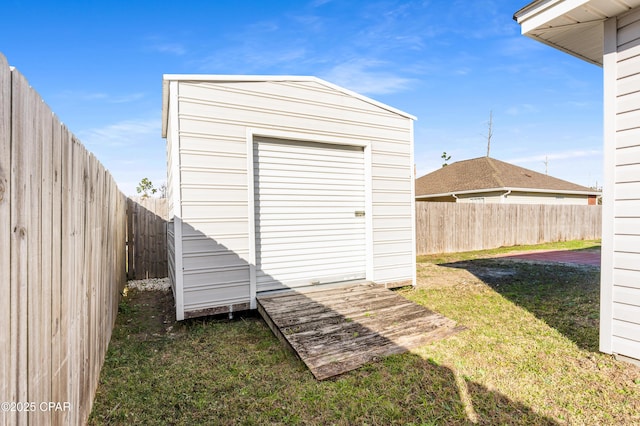 view of shed featuring a fenced backyard