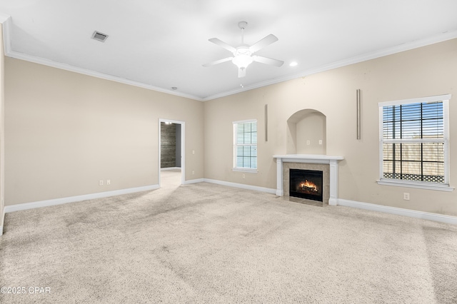 unfurnished living room featuring ornamental molding, visible vents, and baseboards