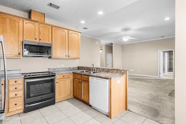 kitchen with white dishwasher, electric range, a sink, visible vents, and stainless steel microwave