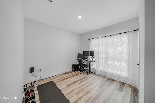 unfurnished office featuring light hardwood / wood-style floors