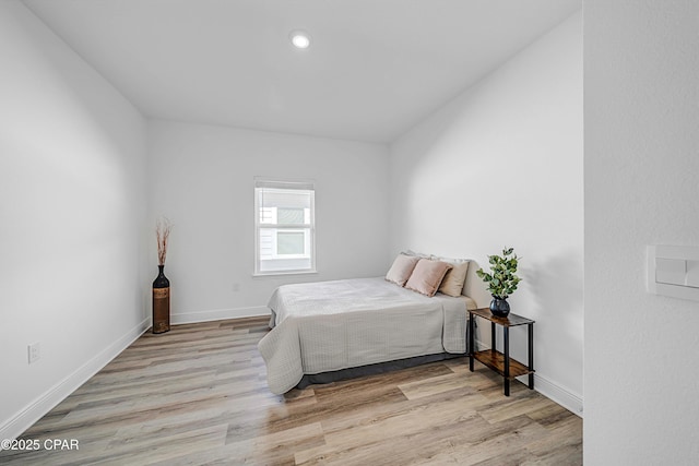 bedroom with light hardwood / wood-style flooring