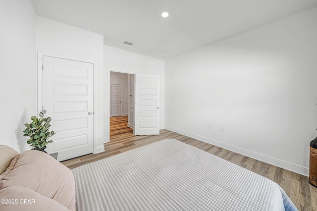 bedroom with light hardwood / wood-style floors