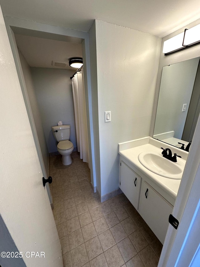 bathroom with toilet and vanity