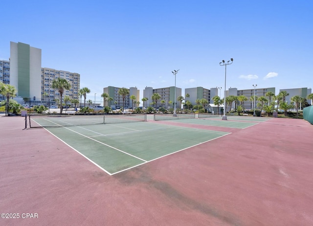 view of tennis court featuring basketball court