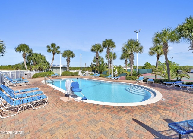 view of swimming pool with a patio