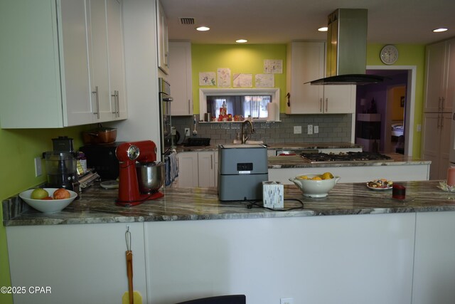 kitchen featuring light tile patterned flooring, sink, white cabinetry, ventilation hood, and white refrigerator with ice dispenser