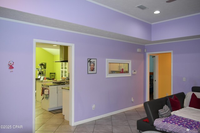 entrance foyer featuring ornamental molding and a textured ceiling